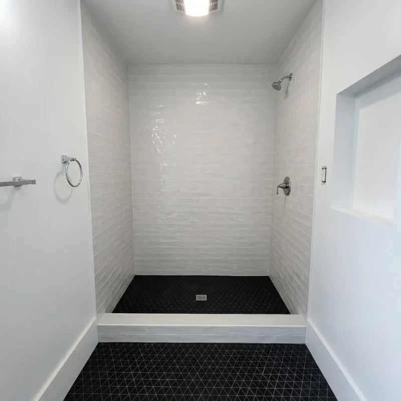 Shower enclosure after remodel by Paez And More